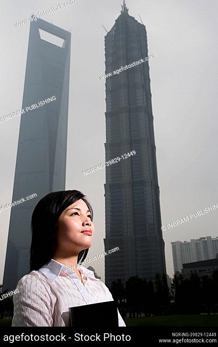 Chinese woman near skyscrapers