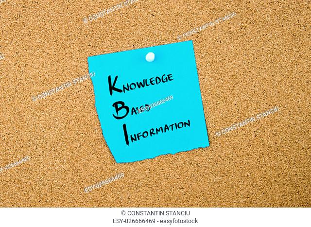 Business Acronym KBI Knowledge Based Information written on blue paper note pinned on cork board with white thumbtack, copy space available