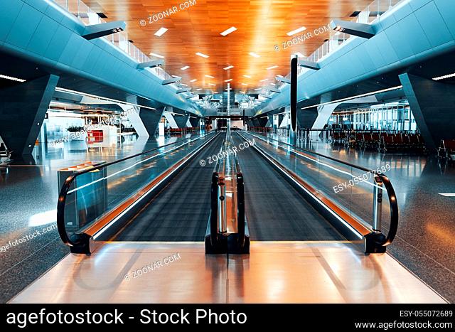 Empty moving walkway in big modern airport. Travel concept