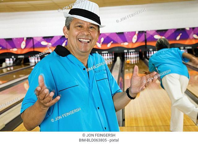 Hispanic man in bowling alley