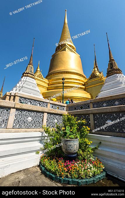 Bangkok, Thailand - December 7, 2019: Gilt Chedi at the Temple of Emerald Buddha (Wat Phra Kaew) and Bangkok's Grand Palace in Bangkok, Thailand