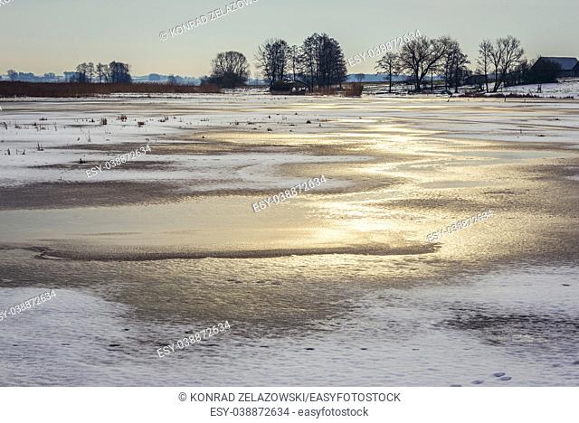 Frozen Narew River in Waniewo village, Wysokie Mazowieckie County in Podlaskie Voivodeship of northeastern Poland