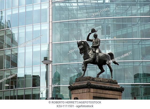 Statue of Albert Prince Consort against the glass front Sainsburys headquarters building in High Holborn, London, England
