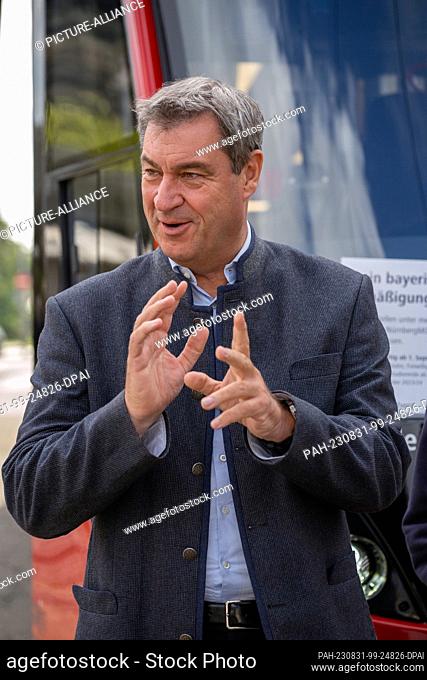 ILLUSTRATION - 31 August 2023, Bavaria, Nuremberg: Bavaria's Minister President Markus Söder (CSU) stands in front of a streetcar at the ""Am Plärrer""...