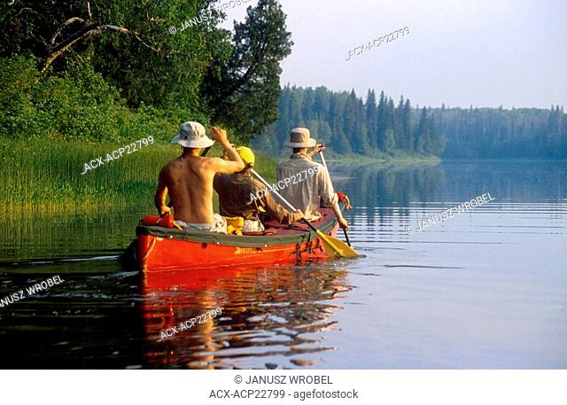 A family paddling the Missinaibi River, Ontario, Canada