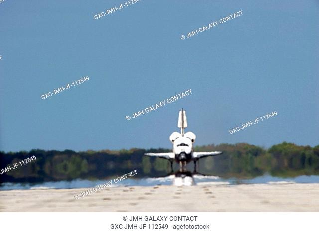 Space shuttle Discovery rolls down Runway 15 at the Shuttle Landing Facility at NASA's Kennedy Space Center in Florida. Landing was at 11:57 a.m