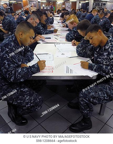 PACIFIC OCEAN Sept  9, 2010 Third class petty officers take the semi-annual advancement exam on the aft mess deck of the aircraft carrier USS Ronald Reagan CVN...