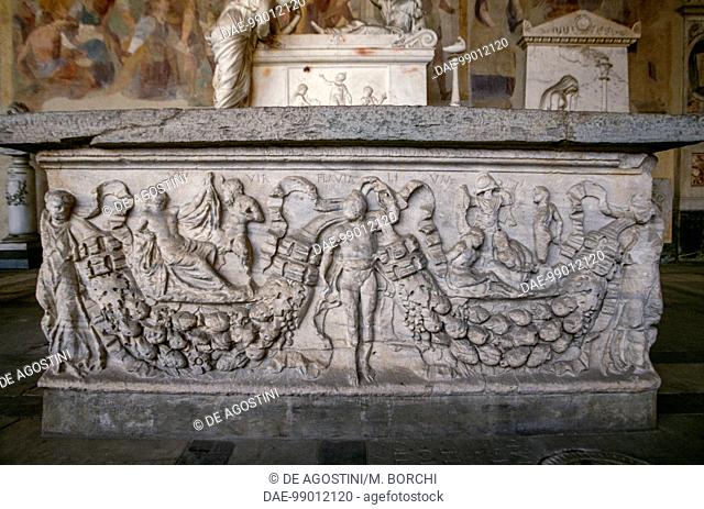 Sarcophagus with relief decoration of a garland flanked at the sides by female figures and at the centre by a masculine figure and two main scenes