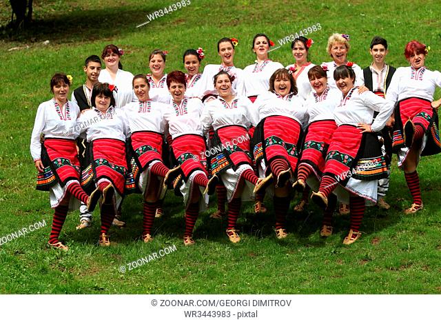 Vratsa, Bulgaria - June 24, 2018: People in traditional authentic folklore costume a meadow near Vratsa, Bulgaria
