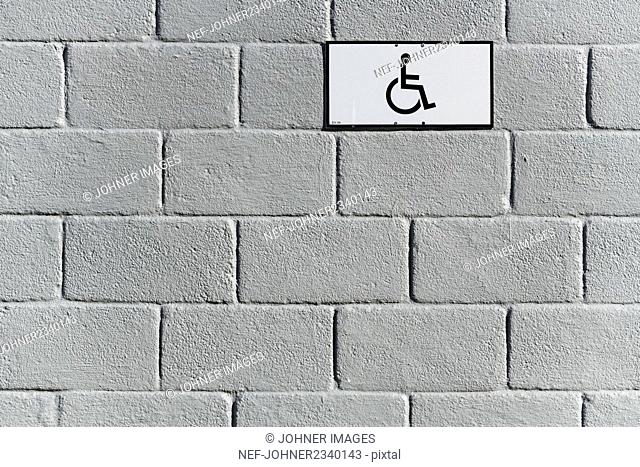 Disabled sign on wall