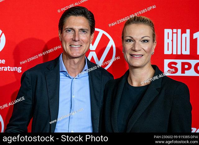 02 June 2023, Berlin: Maria Höfl-Riesch (r), former ski racer, and her husband Marcus Höfl, sports manager, come to the ""Bild100 Sport"" event at Axel Springer...