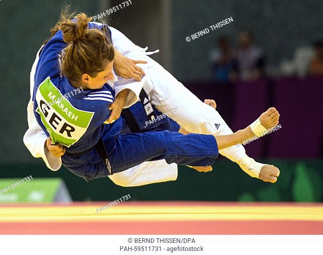 Germanys Mareen Kraeh (blue) competes with Andreea Chitu of Rumania in the Women's -52kg Judo Women's Semifinal of Table B at the Baku 2015 European Games in...