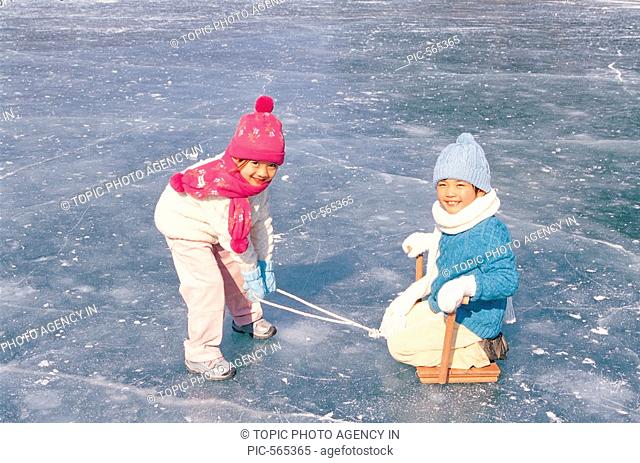 Kids Sledding On Ice, Korean