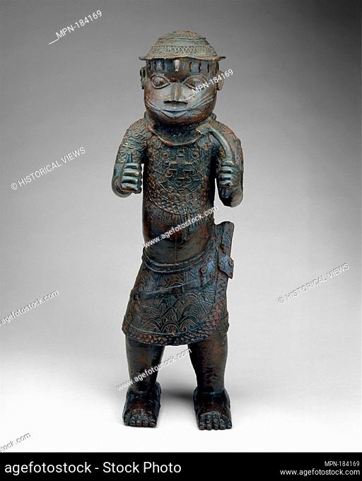 Figure: Court Official with Cross Pendant. Date: 18th-19th century; Geography: Nigeria, Court of Benin; Culture: Edo peoples; Medium: Brass; Dimensions: H