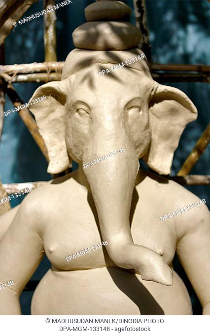 Incomplete lord Ganesha sculpture made of clay for Durga Pooja celebration ; Rajkot ; Gujarat ; India