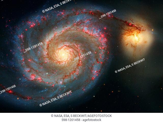 The graceful, winding arms of the majestic spiral galaxy M51 NGC 5194 appear like a grand spiral staircase sweeping through space  They are actually long lanes...