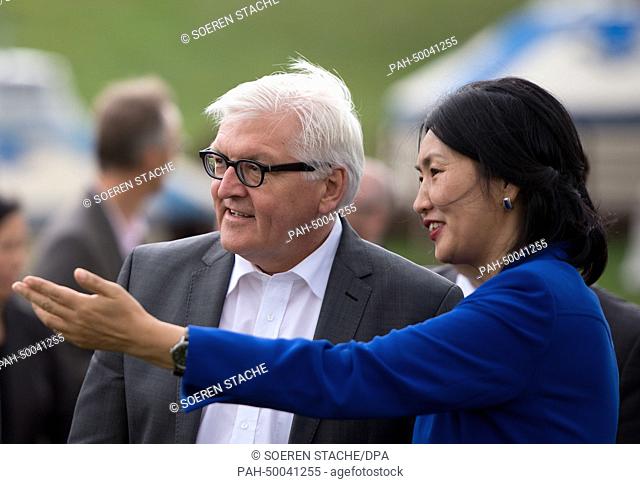 German Foreign Minister Frank-Walter Steinmeier (SPD, L) talks to Mongolian Minister of Culture, Tsedevdamba Oyungerel, as they attend a so-called Naadam...