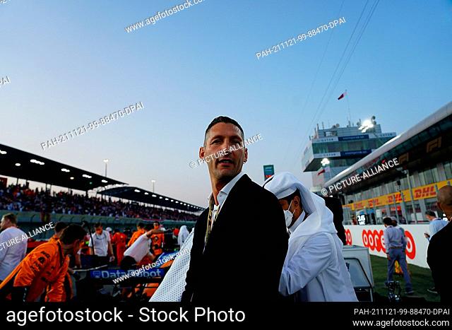 21 November 2021, Qatar, Lusail: Motorsport, Formula 1 World Championship, Qatar Grand Prix: Marco Materazzi stands on the grid on the track before the start of...