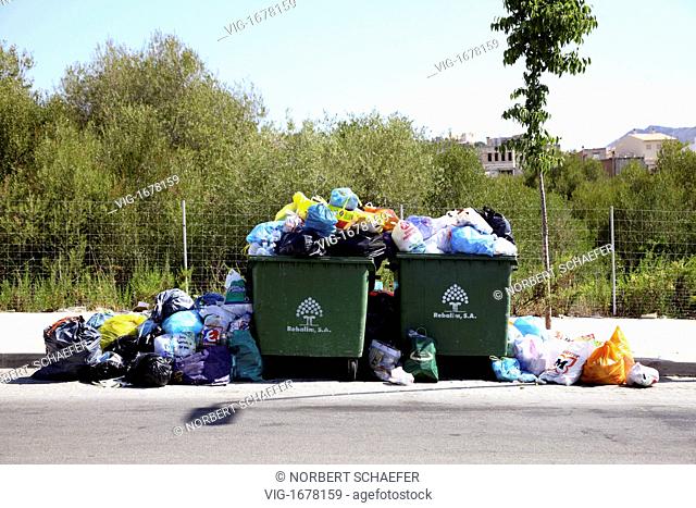 Garbage container are overfull with bin liners in Arta, Mallorca. - ARTA, MALLORCA, SPAIN, 01/01/2009