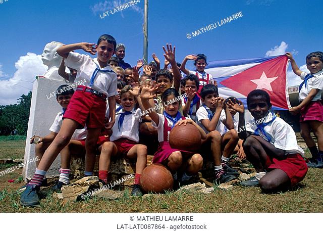 Pinar del Rio. School children in uniforms. Cuban flag