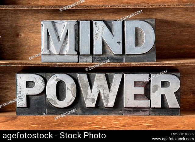 mind power phrase made from metallic letterpress type on wooden tray