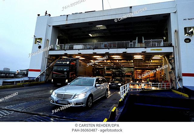 Vehichles leave the Swedish ferry Stena Germanica on the Sweden Quai in Kiel,  Germany, 08 January 2013. On 09 January 2013