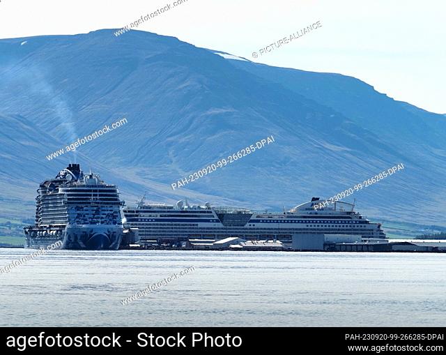 20 August 2023, Iceland, Akureyri: The cruise ships ""AIDALuna"" (r) and ""Norwegian Prima"" are moored in the port of Eyjafjördur fjord
