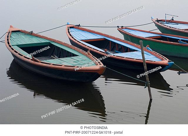 High angle view of boats moored in a river, Ganges River, Varanasi, Uttar Pradesh, India