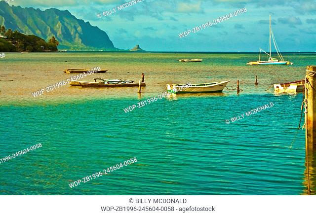Small Fishing Boats Moored Near Heeia Kea Marina With Mokolii Island (Chinamans Hat) Across Kaneohe Bay, Oahu, Hawaii, USA
