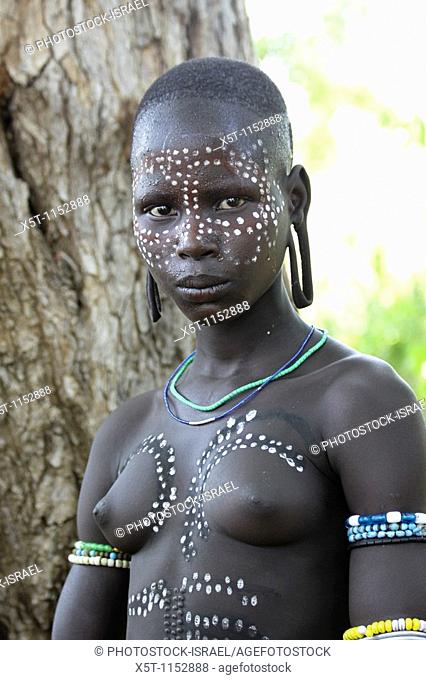 Africa, Ethiopia, Debub Omo Zone, woman of the Mursi tribe  A nomadic cattle herder ethnic group located in Southern Ethiopia
