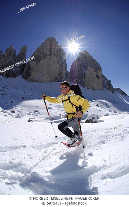 Snowshoeing in front of the mountain Drie Zinnen or Tre Cime di Lavaredo, Italian for Three Peaks of Lavaredo, Hochpustertal Valley or High Puster Valley or...