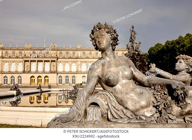 statue of the Fama fountain and Herrenchiemsee palace on the island Herreninsel in lake Chiemsee, Chiemgau, Bavaria, Germany, Europe