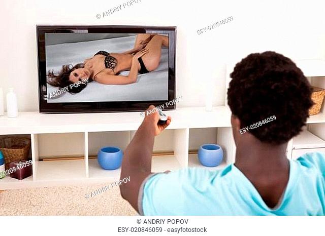 African Young Man Watching Television