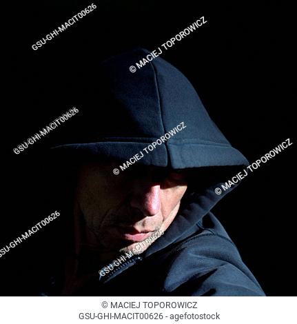 Head and Shoulders Portrait of Man Wearing Hood