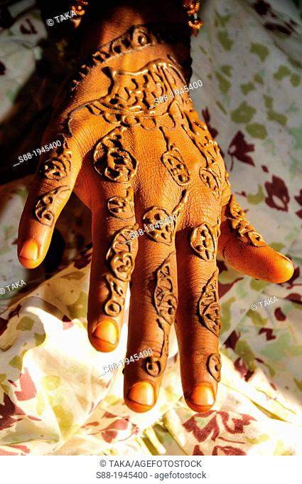 On the day of marriage in the morning, bride having henna painting