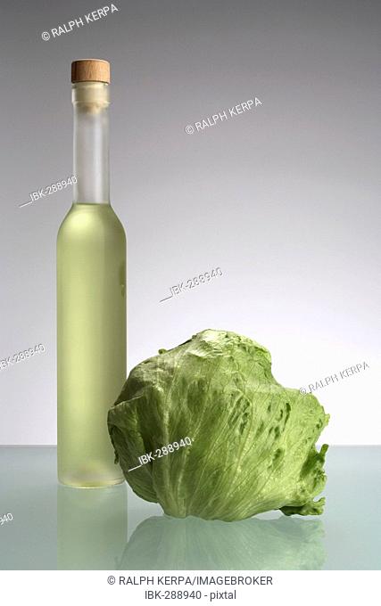 Grape seed oil with a head of lettuce