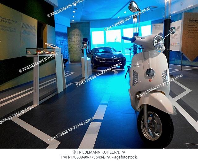 An electronic scooter and an electronic sports car can be seen at the German pavilion at the Expo in Astana, Kazakhstan, 7 June 2017