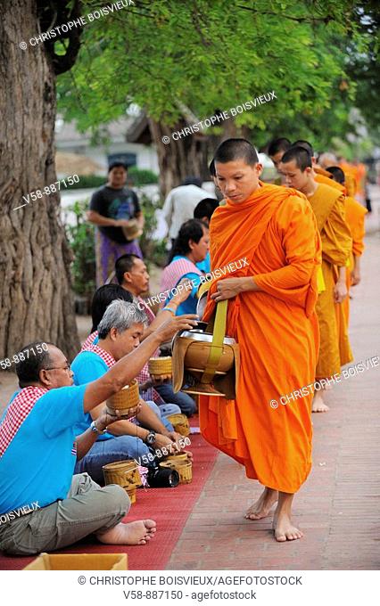 Morning round of buddhist monks begging for alms or Tak Bat, Luang Prabang, Laos