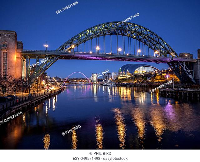 NEWCASTLE UPON TYNE, TYNE AND WEAR/UK - JANUARY 20 : View of the Tyne and Millennium Bridges at dusk in Newcastle upon Tyne, Tyne and Wear on January 20, 2018