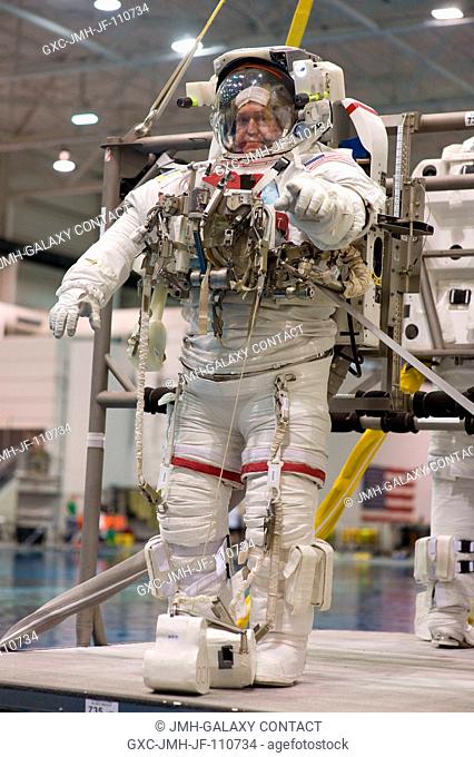 Astronaut Mike Foreman, STS-129 mission specialist, attired in a training version of his Extravehicular Mobility Unit (EMU) spacesuit