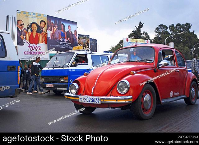 Old red Beetle cruising the streets of downtown Addis Ababa. The most populous city in Ethiopia with a population of 3, 384, 569 inhabitants