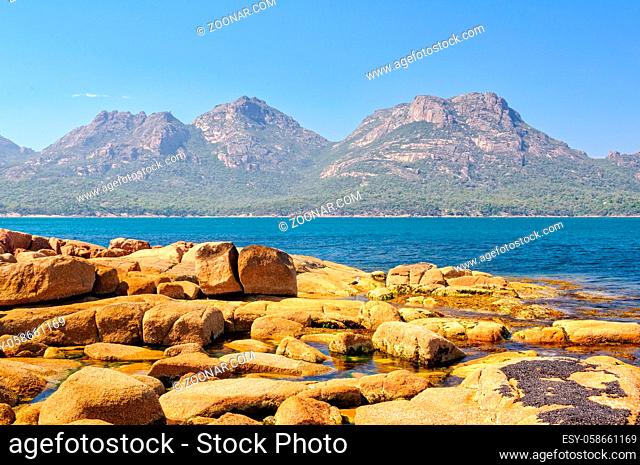 The Hazards mountain ranges in the Freycinet National Park photographed from Coles Bay - Tasmania, Australia