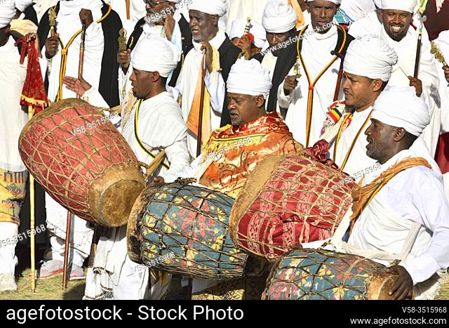 Ethiopia, Lalibela, World Heritage Site, Timkat festival, Dabtaras or choristers beating drums. .