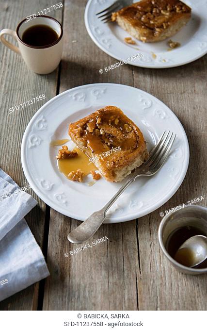 A cinnamon Danish with nuts and syrup