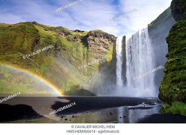 Iceland, Sudurland region, Skogar, rainbow at feet of the falls of Skogafoss