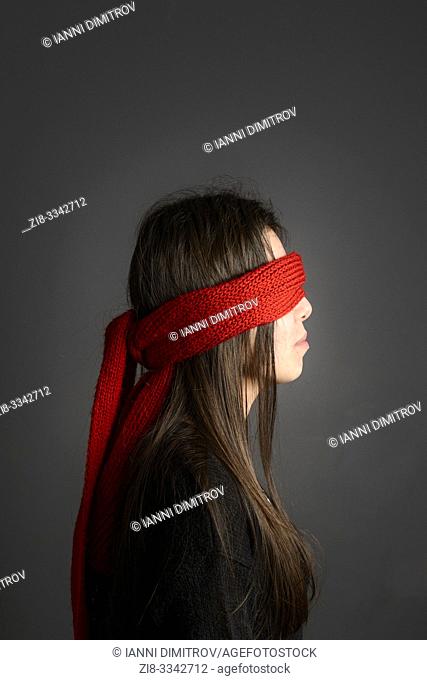 Young girl with long dark hair blindfolded with red scarf- sode vie