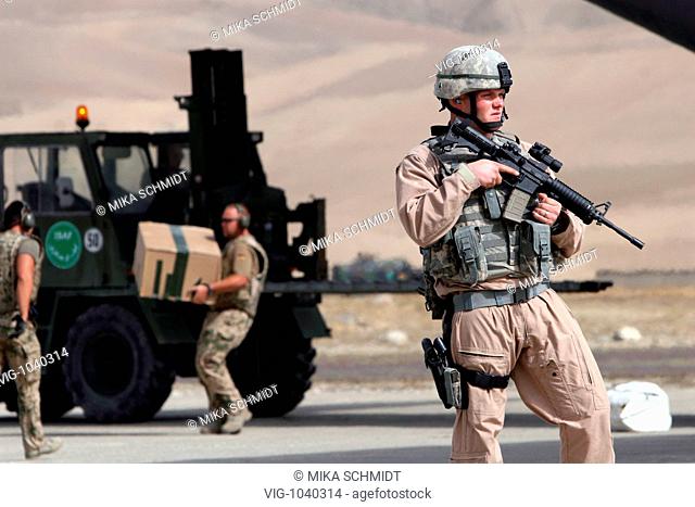 German ISAF soldiers in front of an ISAF transport vehicle on the airfield of Feyzabad in the north part of Afghanistan. - Faizabad, Badkhashan, Afghanistan