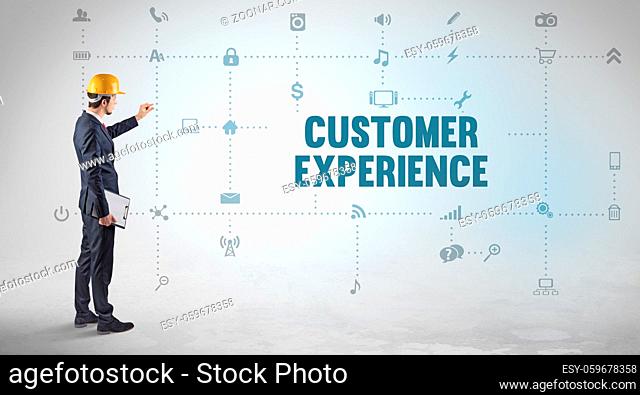 Engineer working on a new social media platform with CUSTOMER EXPERIENCE inscription concept