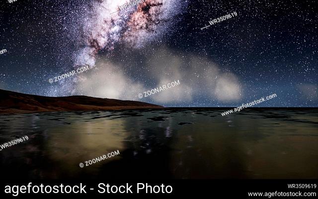 Milk Way stars above the lake at night