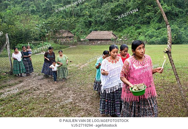 Chahal, Alta Verapaz, Guatemala, women bring offers for the ceremony to pray for a good harvest